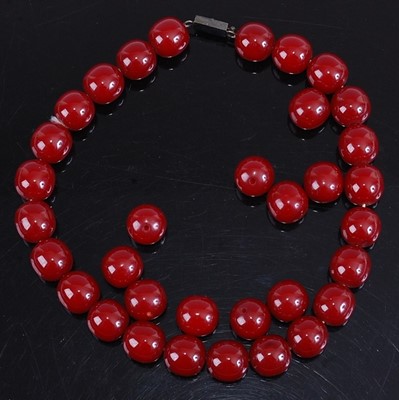 Lot 403 - A faux beaded cherry amber single string...
