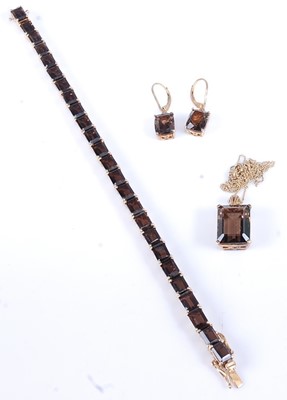 Lot 405 - A gilt metal smoky topaz set garniture,...