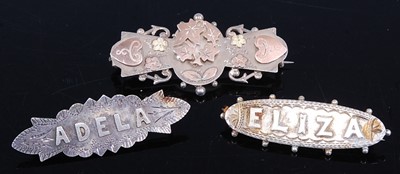Lot 407 - A sterling silver and gold plated bar brooch;...