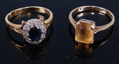 Lot 431 - A yellow metal, blue and white sapphire...
