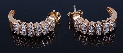 Lot 457 - A pair of modern yellow metal and...
