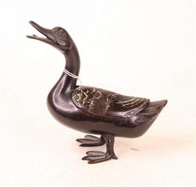 Lot 228 - A modern bronzed trinket jar and cover in the...