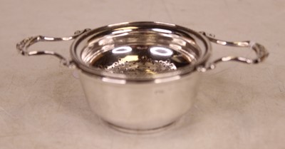 Lot 284 - A mid-20th century unmarked white metal twin...