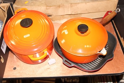 Lot 592 - A Le Creuset cast iron and orange enamelled...