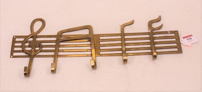 Lot 598 - A 20th century brass coat rail in the form of...