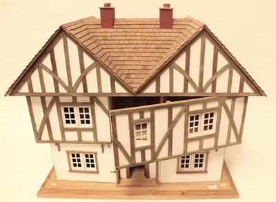 Lot 599 - A 20th century timber framed dolls house in...