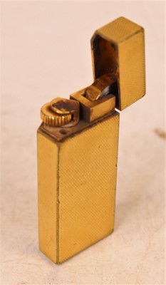 Lot 299 - A Cartier textured gold plated cased pocket...