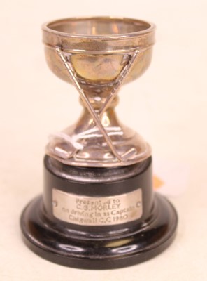 Lot 311 - A George V silver egg-cup, surmounted by two...