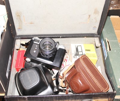 Lot 631 - A vintage black leather suitcase containing a...