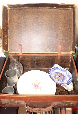 Lot 635 - A tan leather vintage suitcase containing a...