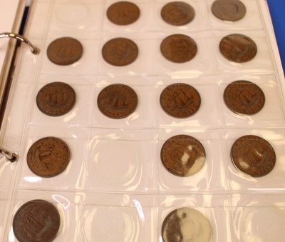Lot 323 - An album of coins, mainly being George VI...
