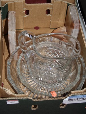 Lot 659 - A box containing a diamond cut glass water jug,...