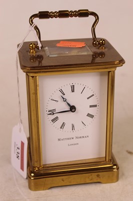 Lot 338 - A lacquered brass cased carriage clock, having...