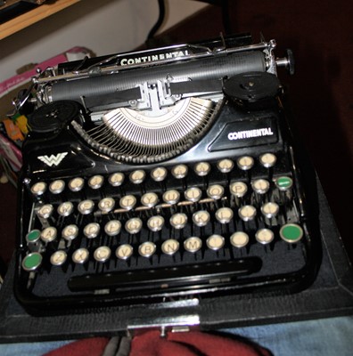 Lot 665 - A vintage continental typewriter, cased