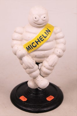 Lot 552 - A cast iron advertising figure of the Michelin...