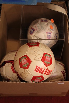 Lot 573 - A collection of four signed footballs to...