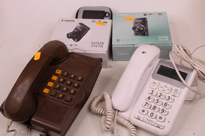 Lot 575 - A box containing a Canon Ixus 255HS digital...