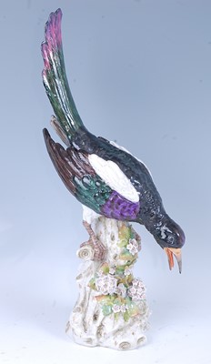Lot 2057 - A circa 1900 Sitzendorf porcelain magpie upon...