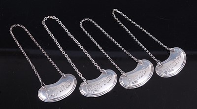 Lot 2230 - A set of four Edwardian silver decanter...