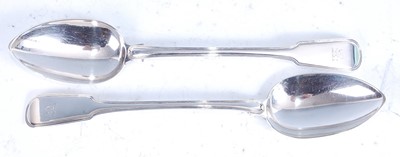 Lot 2089 - A pair of George III silver stuffing spoons in...