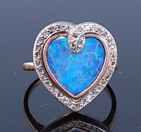 Lot 2329 - A yellow and white metal, composite opal and...
