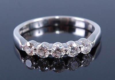 Lot 2323 - A platinum 'Hearts on Fire' diamond half hoop...