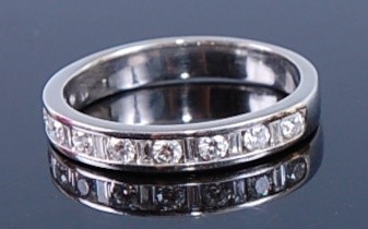 Lot 2346 - A white metal diamond half hoop eternity...