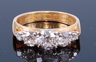 Lot 2348 - A 22ct yellow gold diamond half hoop eternity...