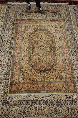 Lot 2588 - A Persian woollen rug, the central brown...