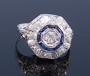 Lot 2359 - A white metal, diamond and sapphire Art Deco...