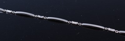 Lot 2355 - A contemporary platinum and small baguette cut...