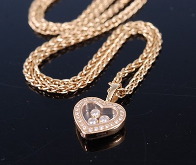 Lot 2372 - A Chopard 18ct gold 'Happy Diamonds' heart...