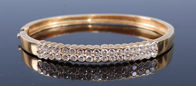 Lot 2380 - A yellow metal diamond set hinged...