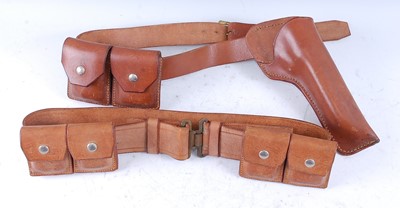 Lot 238 - A brown leather belt with with four ammunition...