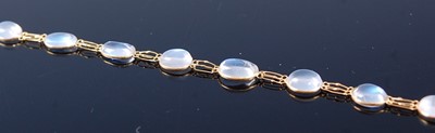 Lot 2370 - A contemporary yellow metal and moonstone set...