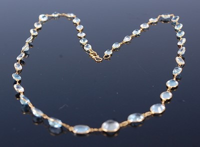 Lot 2368 - A contemporary yellow metal and aquamarine...