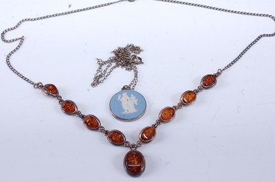 Lot 331 - A white metal and clear orange orange amber...