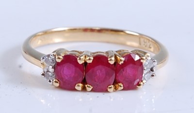 Lot 2166 - A yellow metal, ruby and diamond dress ring,...