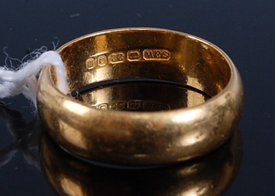 Lot 315 - A 22ct 5.65mm D shaped wedding ring, size N,...