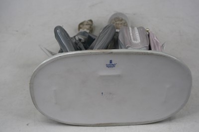 Lot 4 - A Lladro porcelain figure group of a couple...