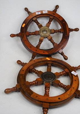 Lot 19 - A pair of reproduction hardwood ships wheels,...