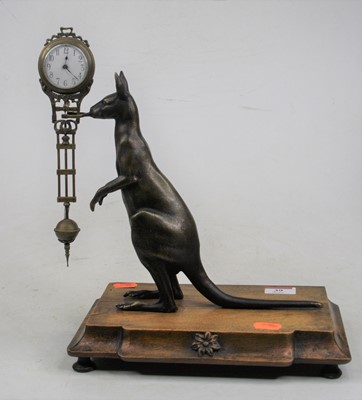 Lot 39 - A 20th century bronze novelty mystery clock,...