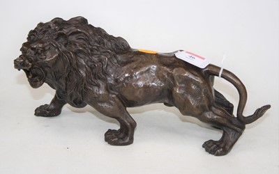 Lot 46 - A bronze model of a prowling lion, h.15cm