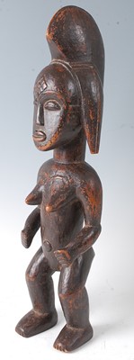 Lot 61 - An ancestor figure, carved as a nude female in...