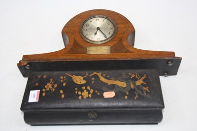 Lot 109 - A 1920s black lacquered and gilt decorated...