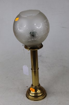 Lot 137 - An early 20th century brass pedestal candle...