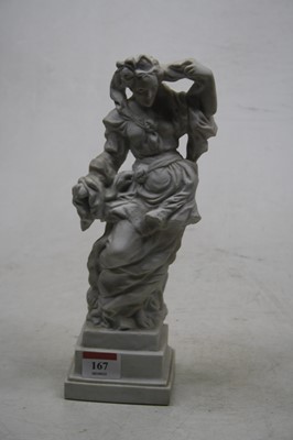Lot 167 - A Royal Dux bisque figurine on stepped square...