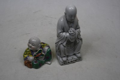 Lot 194 - A Chinese blanc de chine figure of a seated...
