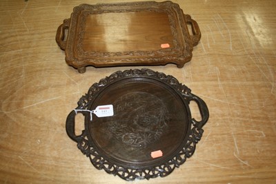 Lot 143 - A 20th century oak tray of circular form...