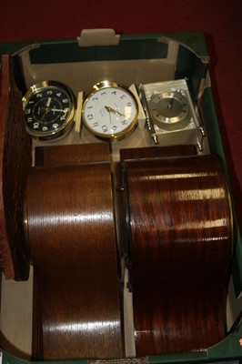 Lot 163 - A 1920s oak cased mantel clock having a...